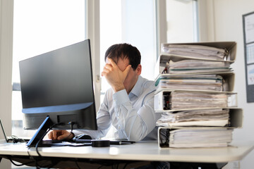 Fototapeta na wymiar Frustrated Tired Man With Invoices