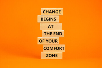 Out from comfort zone symbol. Wooden blocks with words Change begins at the end of your comfort...