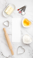 Mock up with white paper with space for text, around ingredients for baking cookies. Concept cooking with love, cooking for your loved ones, baking for valentines day. Copy space. Top view