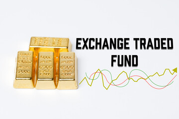 Selective focus word exchange traded fund word, graph and gold bar.  It is an open-ended investment fund listed and traded on a stock exchange.