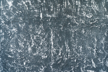Texture of a gray wall with worn elements. Gypsum plaster with chaotic lines and strokes. flat lay frame