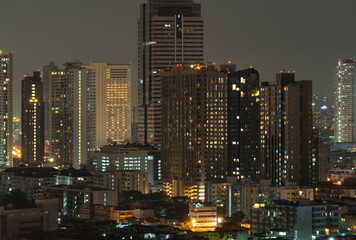 Fototapeta na wymiar Aerial view of Sathorn, Bangkok Downtown skyline. Financial district and business centers in smart urban city town in Asia. Skyscraper and high-rise buildings at night.