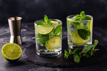 Refreshing summer alcoholic cocktail mojito with ice, fresh mint and lime