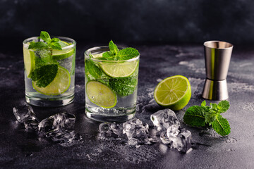 Refreshing summer alcoholic cocktail mojito with ice, fresh mint and lime