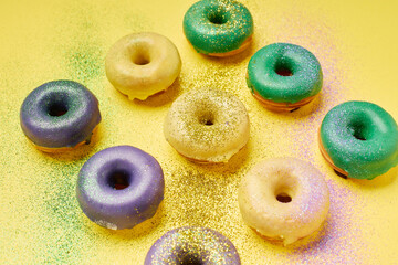 Colorful Mardi Gras donuts for Fat Tuesday celebration.