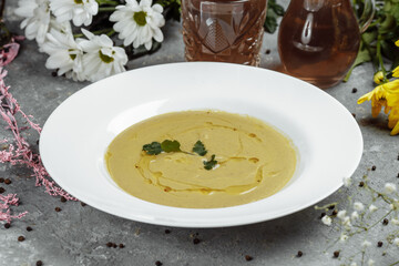 Delicious cream soup with bread on the table