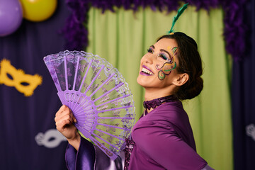 Beautiful woman celebrating Mardi Gras festival and wearing carnival costume on a party.