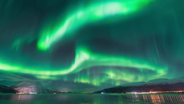A very strong northern lights activity captured on a time lapse video over the Northern Scandinavia in Norway. High quality 4k footage
