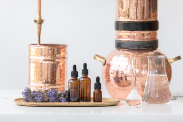 Distillation of lavender essential oil. Copper alambic in a Scandinavian interior. Chemical laboratory