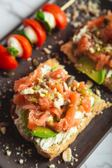 Smoked salmon toast with avocado. closed image