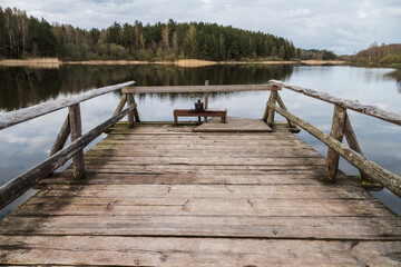 Rural landscape with an empty wooden pier