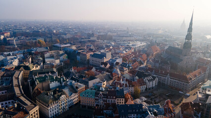  Riga old town center with cathedrals in foggy morning	