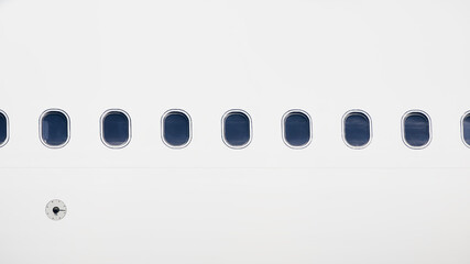 Windows on fuselage of airplane. White plane with copy space.