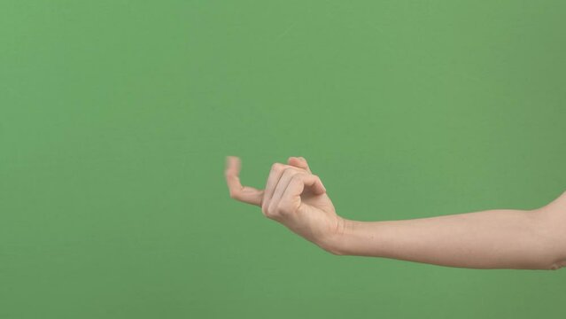Beckoning, inviting sign. Woman hand waving, inviting somebody come. Hand gesture on green screen chroma key background. 4k footage video