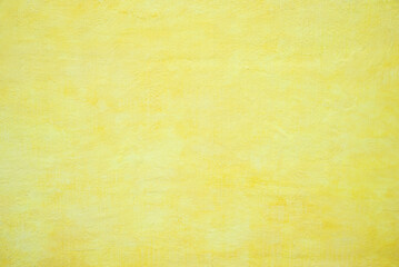 Obraz premium concrete wall structured with spatula technique, bright yellow color