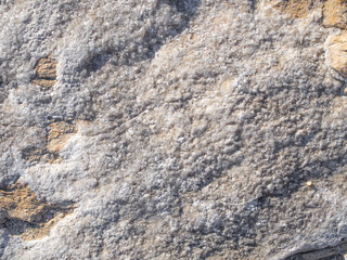 Texture of stone with mineral crystals. Rock background