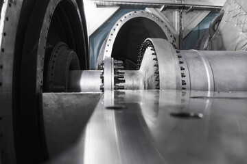 The rotor of a gas turbine compressor with a bolted coupling half