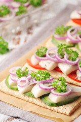 Sandwiches with herring and vegetables	