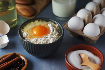 Food ingredients for baking: flour, eggs, milk, sugar	