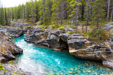 blue river canyon in forest near Nordegg Alberta
