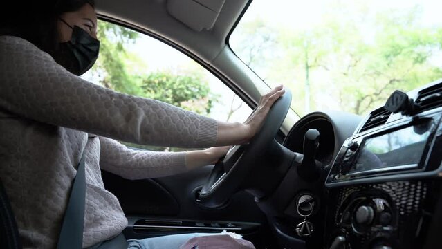 Angry woman driving a car 