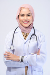 Female muslim doctor with hijab over white background studio.