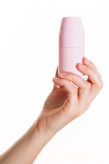 The girl holds a package of ball deodorant in her hand