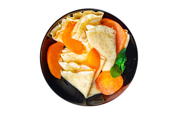 thin pancake persimmon crepe Shrovetide holiday Maslenitsa sweet dessert breakfast pancakes food snack on the table copy space food background 