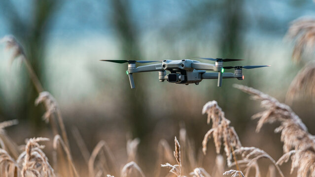 Drone in flight over marshland, Devon, England