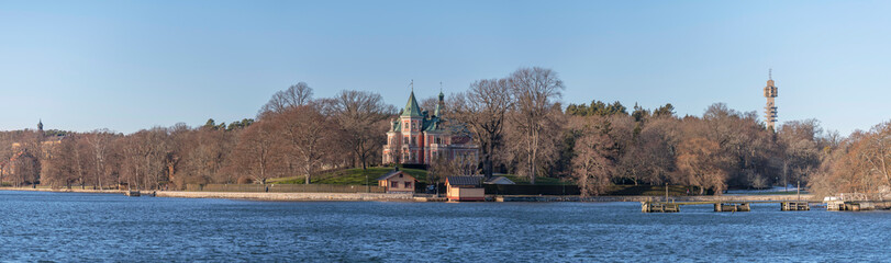 Sea view over the ness and villa Täcka Udden built 1870 a sunny winter day at the waterfront in the island Djurgården in Stockholm