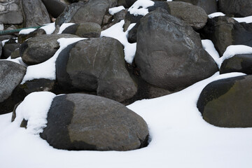 Snow covered stones , close up view