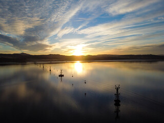 Sunset above the lake. Beautiful lake in nature, aerial drone view.  