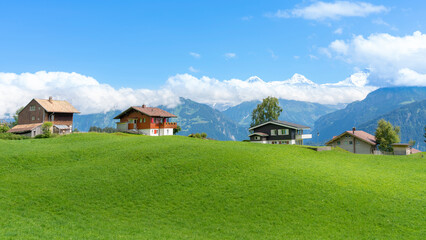 typical village with wooden houses on top of the swiss alps - switzerland.