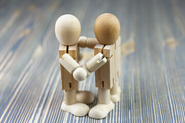 The wooden figure of a man is dancing. Dance toys.