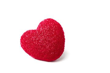 Red marmalade heart in shiny sugar crystals, close-up, isolated on a white background. Valentine's Day concept.