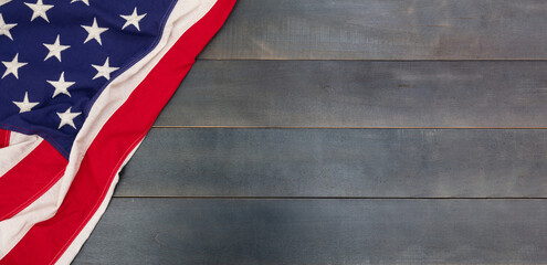 USA flag on wooden background. US of America sign symbol overhead, copy space.