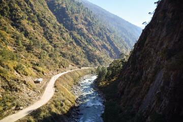 Fototapeta na wymiar Beautiful curving river in the Himalaya mountains in Nepal. Tamang Heritage Trail and Langtang trek day 4 from Nagthali to Lingling