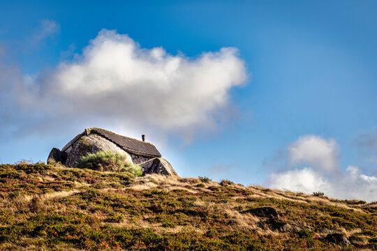 Strange house in the middle of two rocks in the north of Portugal, in Fafe - "Casa do Penedo" - flingstones house.