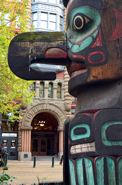 A traditional native American Totem pole stands in the public park in the heart of Pioneer Square in Seattle