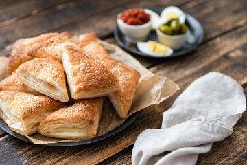 Israeli breakfast burekas with cheese, matbucha and eggs