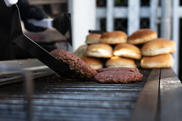 Hamburger meat on the grill about to be prepared