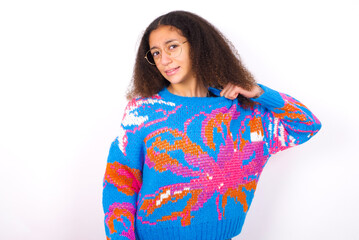 African teenager girl wearing colorful sweater over white background stressed, anxious, tired and frustrated, pulling shirt neck, looking frustrated with problem