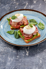 toasts with poached egg and bacon