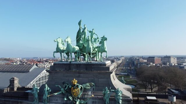 Drone view around the statues of the triumphal arch at Cinquantenaire park or Jubelpark in Brussels