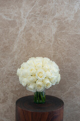 Wedding rounded bouquet in marble background, vertical image