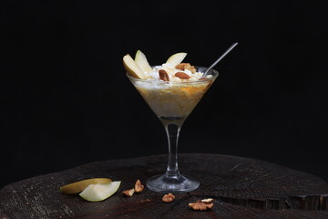 Cottage cheese with honey and nuts in a glass