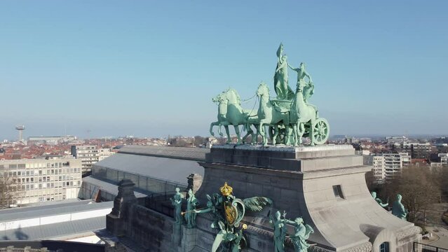 Drone view around the side of the triumphal arch statues at Cinquantenaire park or Jubelpark in Brussels