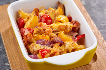 roasted vegetables with meat and cheese