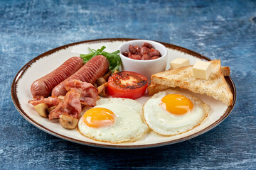 traditional breakfast with egg and sausages