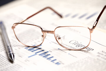 eyeglasses on the newspaper pages